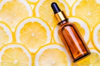 Fragrance bottle and lemon slices