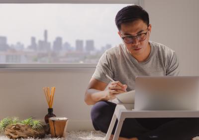 man in casual wear working from home office