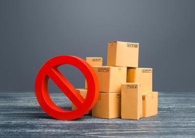 Red circle with a diagonal line next to cardboard boxes
