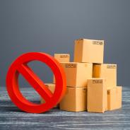 Red circle with a diagonal line next to cardboard boxes